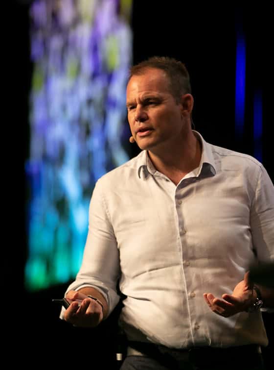 Andrew Andrew speaking on stage
